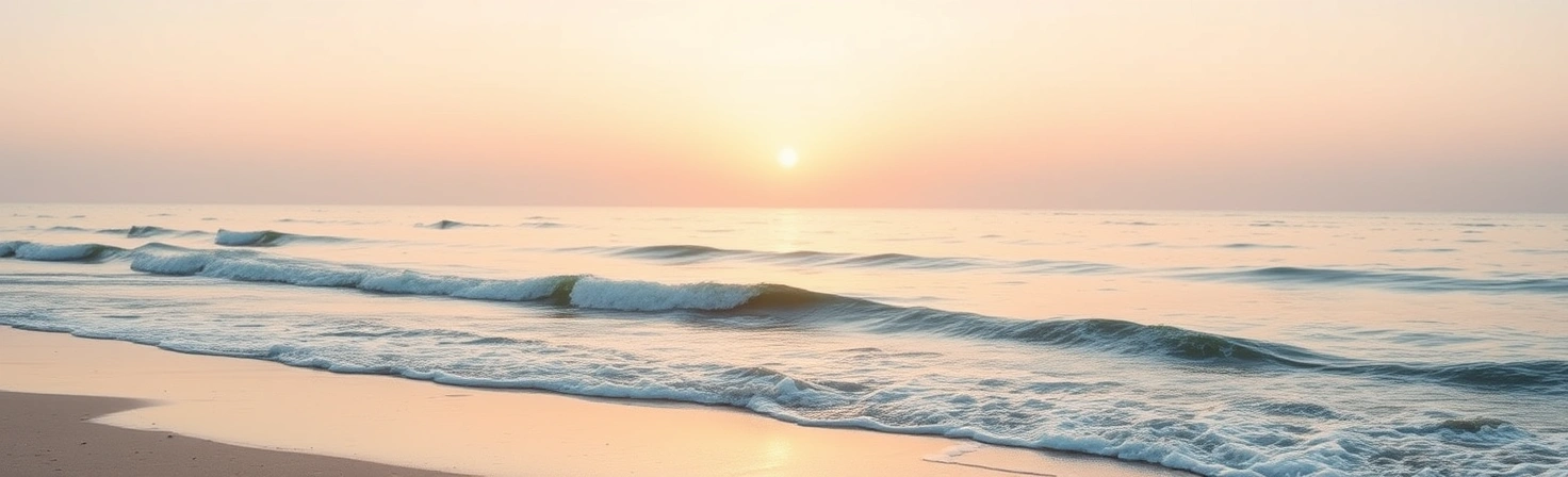 Dreamy coastal scene at golden hour with gentle waves and pink-orange sky